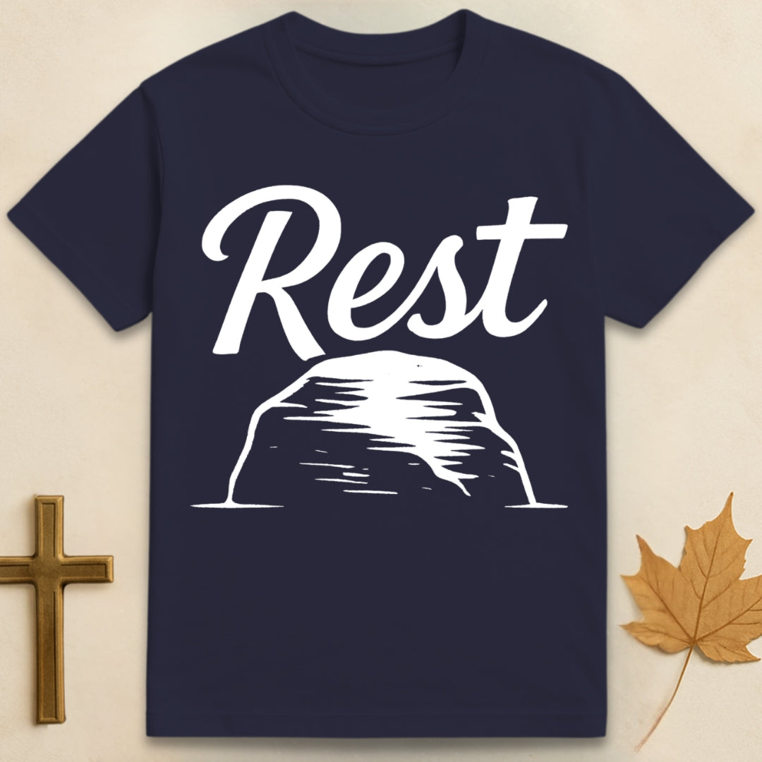 Navy Blue rest in God t-shirt with “rest” text above a simple rock illustration