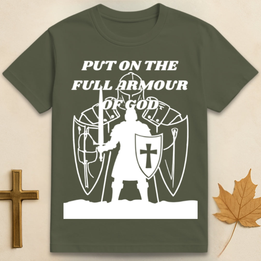 Green Armor of God t-shirt featuring medieval soldier graphic with shield bearing cross emblem and text "Put on the Full Armor of God".