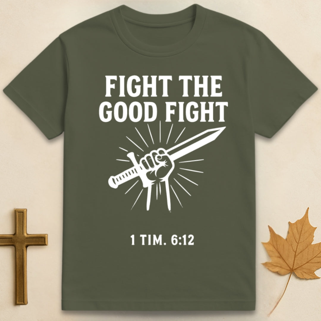 Green The Good Fight t-shirt featuring graphic of hand holding a sword with text "Fight the Good Fight" above and "1 Tim 6:12" below.