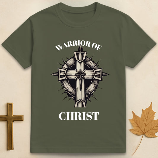 Green Warrior of Christ t-shirt with cross and thorn crown graphic, featuring text "Warrior of" above and text "Christ" below the design.