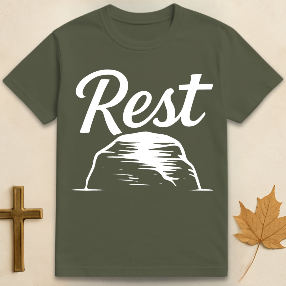 Military Green rest in God t-shirt with “rest” text above a simple rock illustration