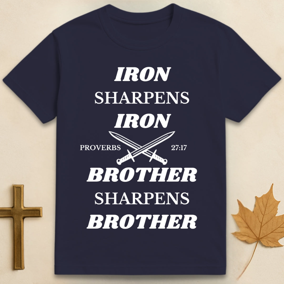 Navy blue Iron Sharpens Iron t-shirt featuring graphic of two crossed swords with text "Iron Sharpens Iron" above and "Brother Sharpens Brother" below.