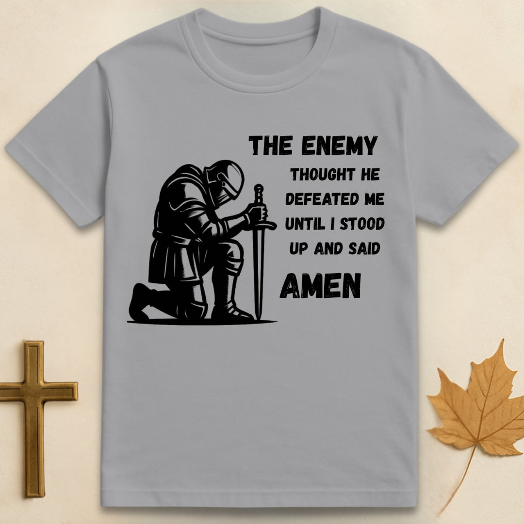 Sports grey Amen t-shirt featuring kneeling soldier graphic with sword planted in the ground and text "The enemy thought he defeated me until I stood up and said Amen".